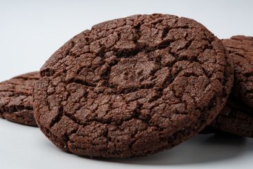 Deliciously baked chocolate cookies arranged on a clean...