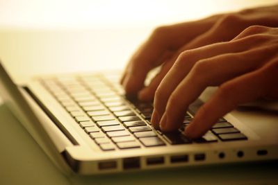 Businessman hands working on laptop