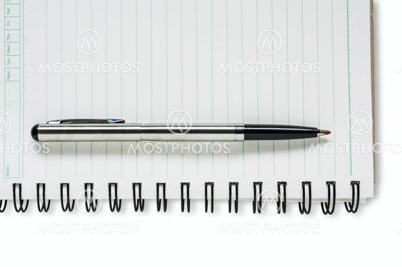 A pen on a spiral notebook