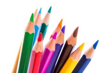 Colorful set of sharpened pencils arranged creatively...