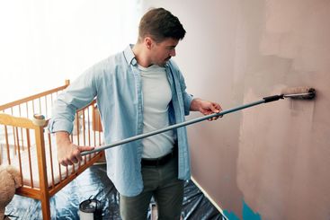 Home, diy and man painting in nursery for interior...