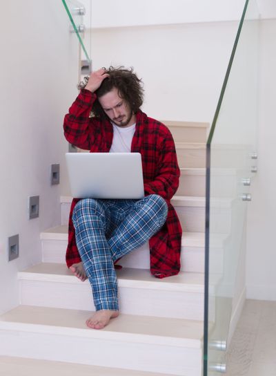 freelancer in bathrobe working from home