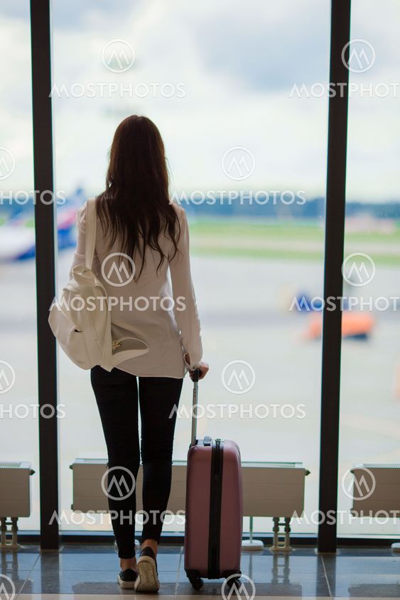 Silhouette of airline passenger in an airport lounge...