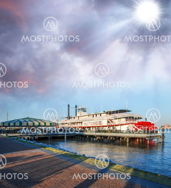 River boat with beautiful sky at sunset