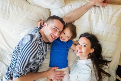 Parents having fun with their cute little daughter