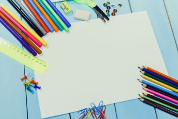 Creative workspace with a variety of colorful art...