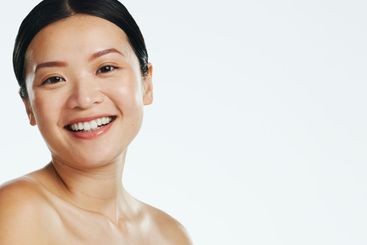 Skincare, asian woman and face of beauty, smile or...