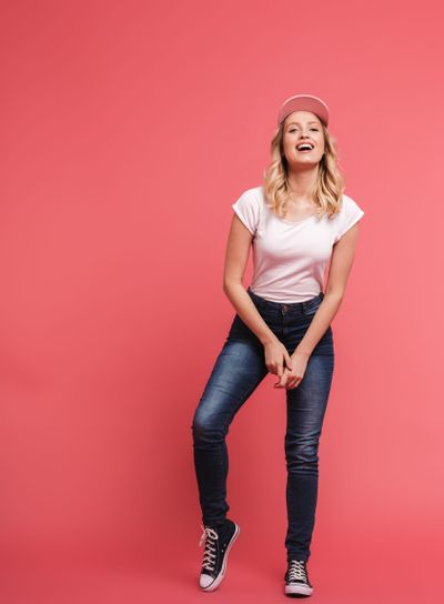 Full length portrait of young blond woman 20s wearing...