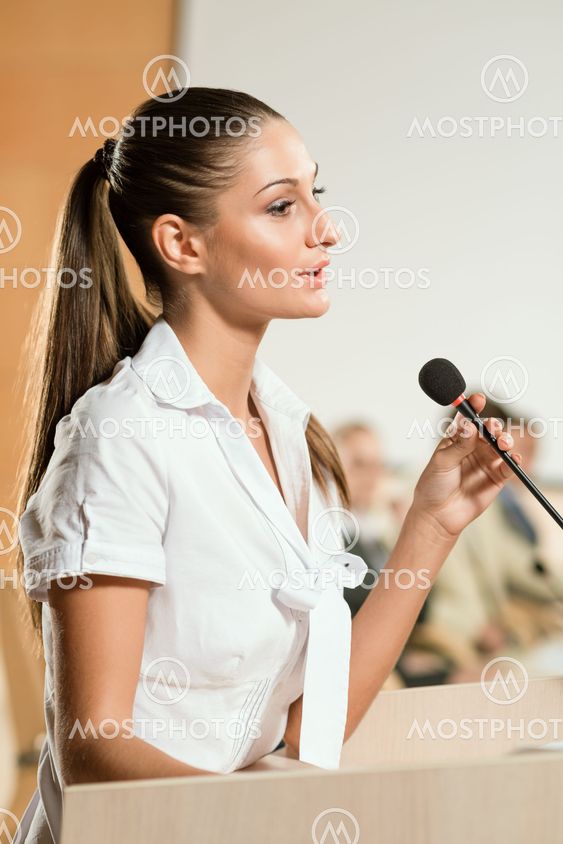 Portrait of a business woman with microphone