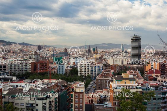Barcelona city under cloudy sky overview