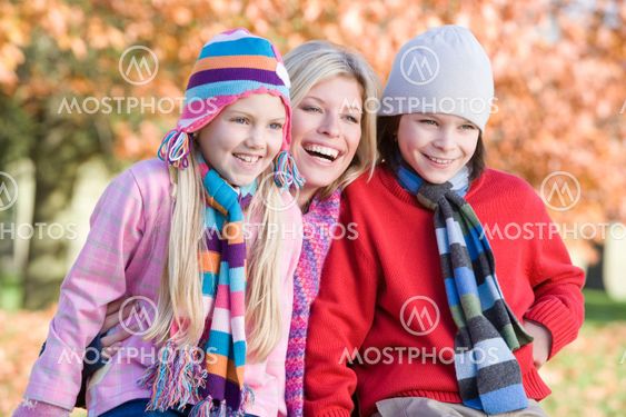 Mother and children on autumn walk