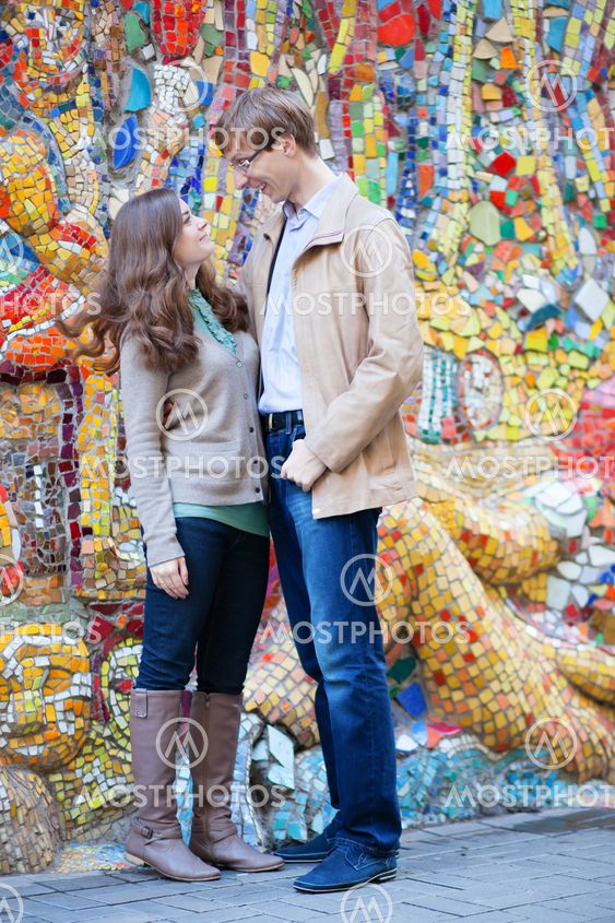 Happy couple looking to each other and smiling