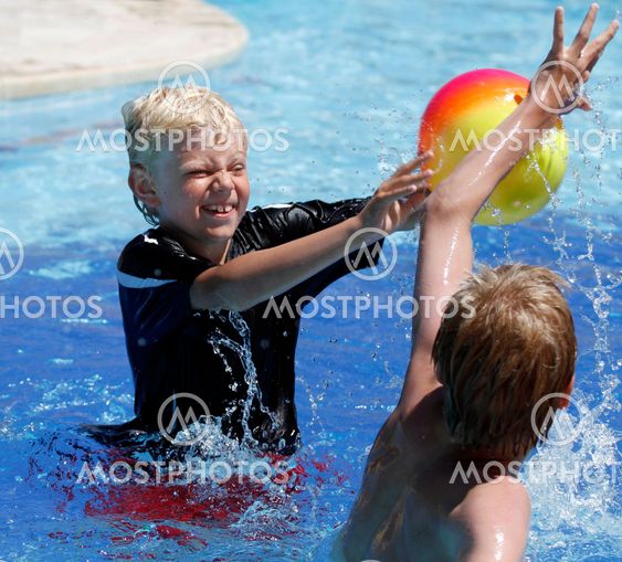 Boys with ball in pool 1