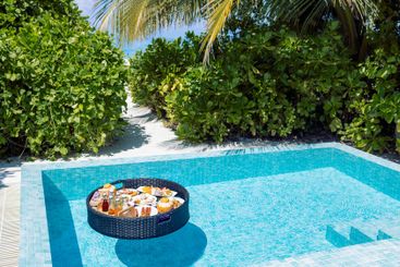 A floating breakfast tray with various dishes and drinks...