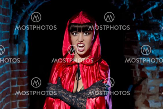 Halloween. Bloodthirsty Vampire Beautiful Woman in the dungeon