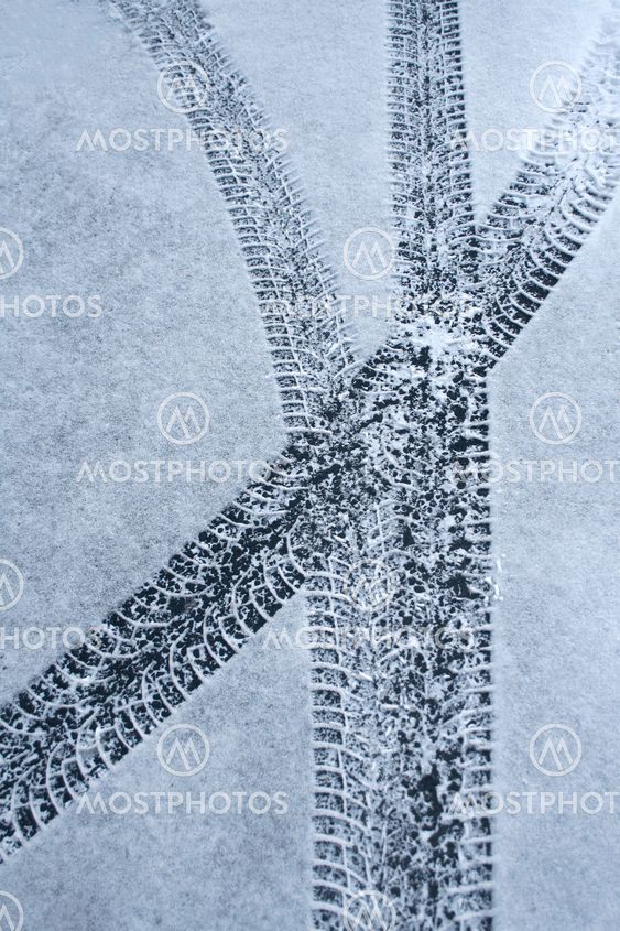 Car tire tracks in snow