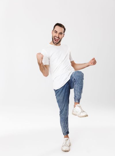 Full length of a handsome cheerful man