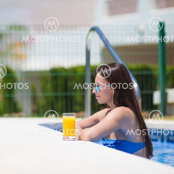 Young beautiful woman listening music with headphones...