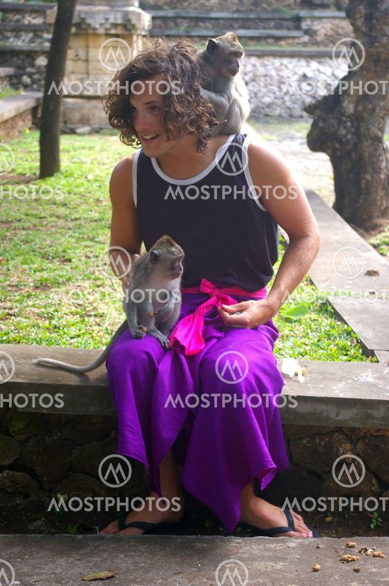 Tourist with monkeys
