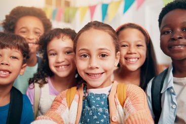 Portrait, students and smile for selfie in classroom for...