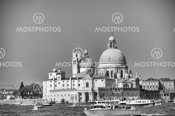 VENICE, ITALY - MAR 23, 2014: City view with landmarks and boats. The city has 21 million visitors each year