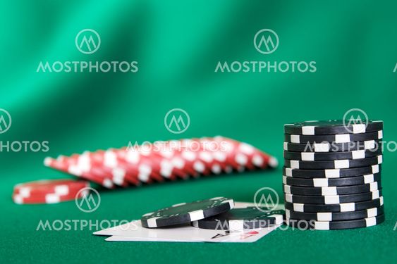 Stack of chips and two aces