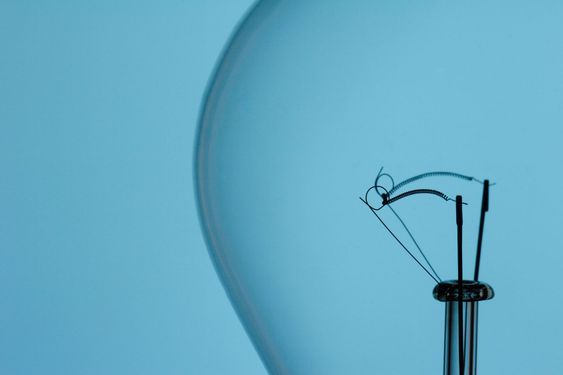 light bulb filament on blue background