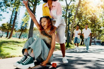 Fun, skateboarder and friends with smile, freedom and...