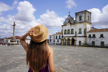 Tourism in Sao Cristovao, Brazil. Young touirist woman...