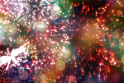 Colourful fireworks exploding on black background