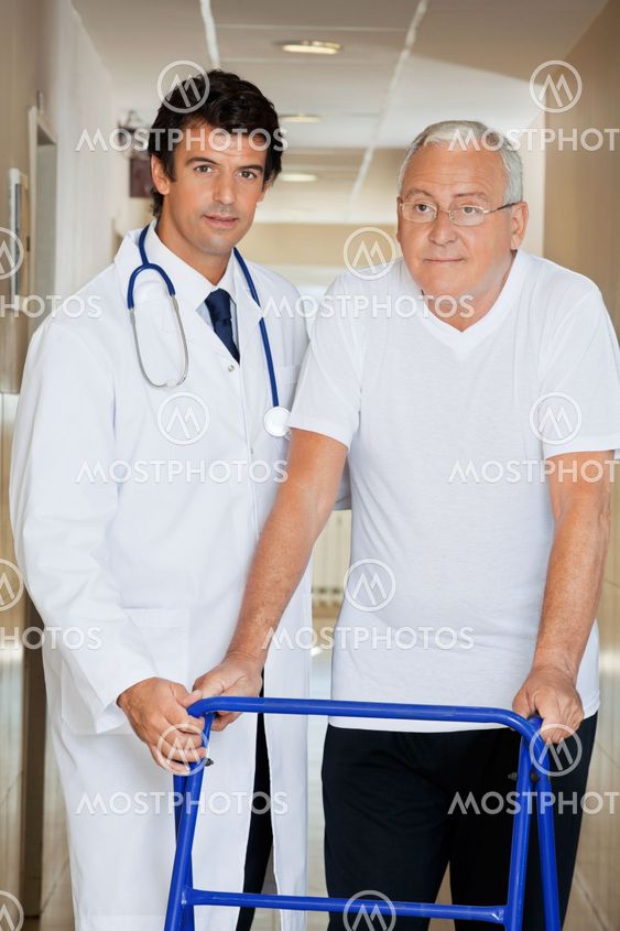 Doctor Helping An Old Man With His Walker