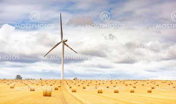 Windmill turbine in a agricultural landscape with fields...