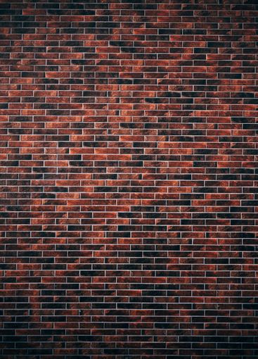 Texture of a building facade decorated with brick slips