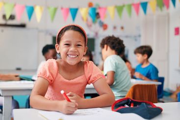 Writing, student and portrait with girl in classroom for...