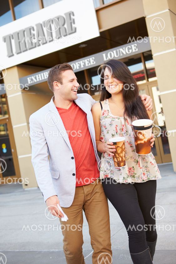Couple Standing Outside Cinema Together