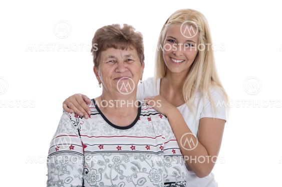 Portrait of real grandmother with her granddaughter.