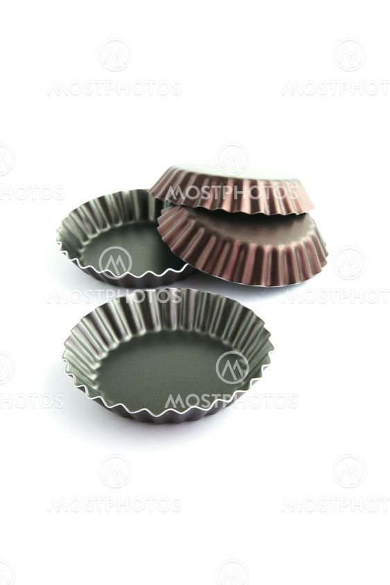 Four corrugated cake tins