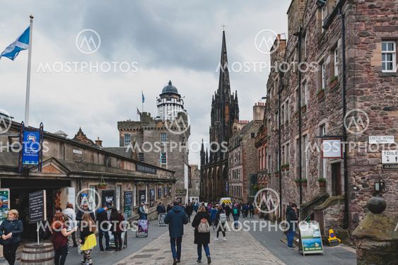 Edinburgh, Scotland - April 2018: Royal Mile, touristic street of Old Town Edinburgh City in Scotland, with Tron Kirk, former gothic church, now functioned as The Hub, a venue for various events and festivals