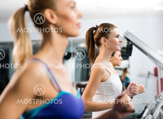 women running on a treadmill
