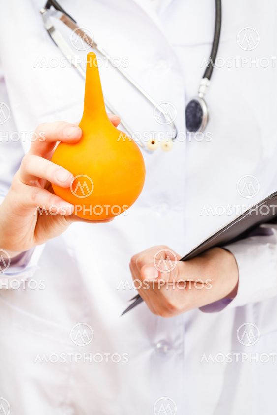 doctor hold yellow rubber enema