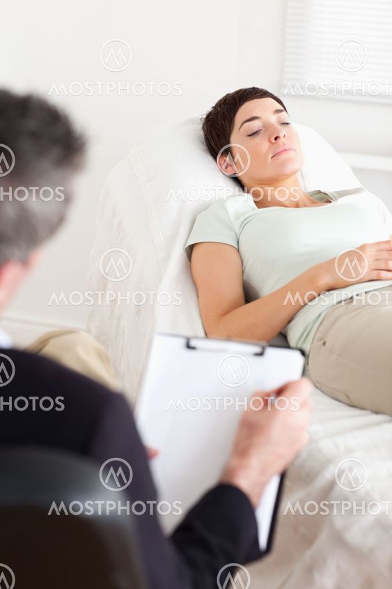 Psychologist talking to a female patient