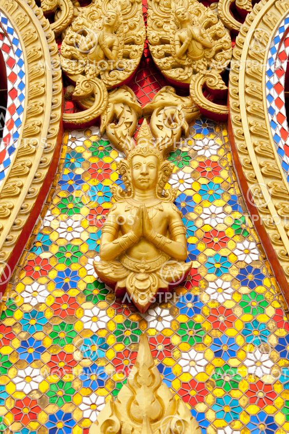 The gold stucco design of native thai style on the Wall