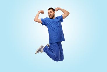 happy smiling doctor or male nurse jumping in air