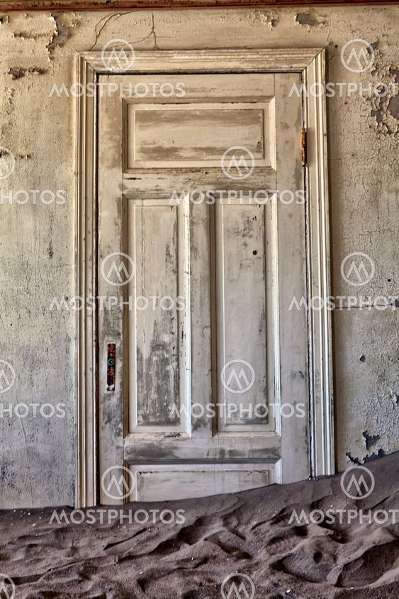 door in a ghosthouse in kolmanskop ghost town near luderitz namibia