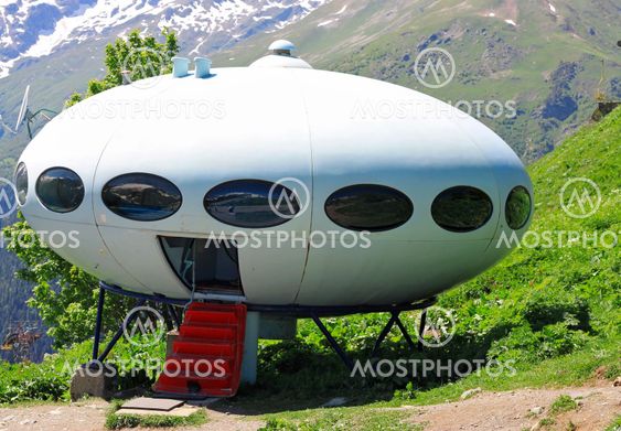 UFO and Caucasus mountains landscape summertime