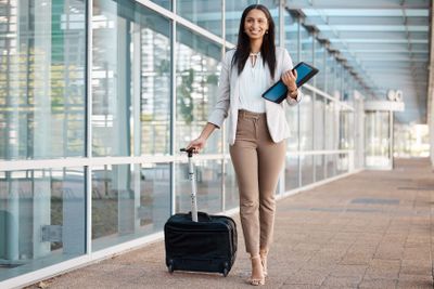 Travel, airport and and suitcase with business woman and...