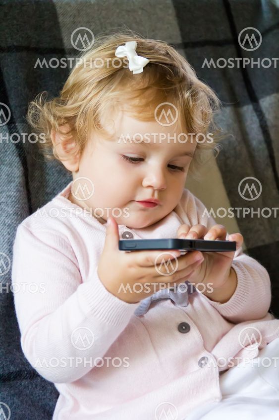 Cute infant with cellular