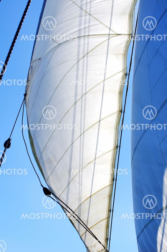 Full Sails on wind and blue sky