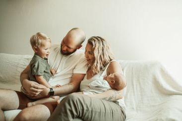 bond, happy family and parents with baby and toddler on...