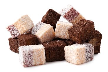 Assorted traditional sweets arranged in a colorful...